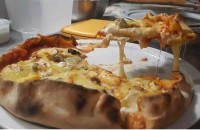 Βίντεο: Πώς ένας Γάλλος σεφ κατέρριψε το ρεκόρ Γκίνες με μία πίτσα