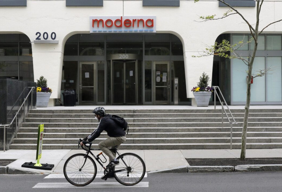 A bicyclists pedals past an entrance to a Moderna, Inc., building, Monday, May 18, 2020, in Cambridge, Mass. Moderna announced Monday that an experimental vaccine against the coronavirus showed encouraging results in very early testing, triggering hoped-f A bicyclists pedals past an entrance to a Moderna, Inc., building, Monday, May 18, 2020, in Cambridge, Mass. Moderna announced Monday that an experimental vaccine against the coronavirus showed encouraging results in very early testing, triggering hoped-f